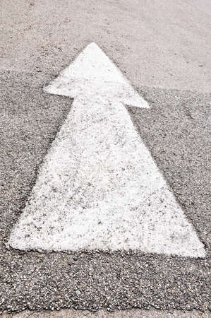 White arrow sign on road floorの写真素材