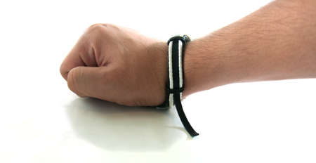 white and black wrist handicraft in handの写真素材