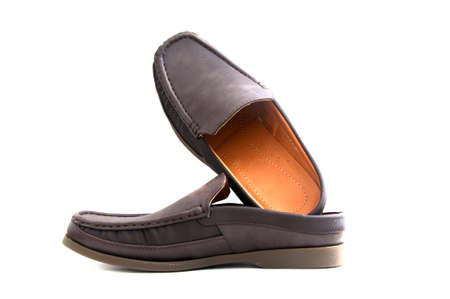 brown slip-on casual shoes over a white background