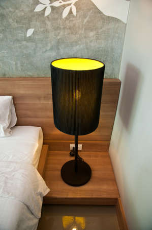 stylish black table lamp in bedroomのeditorial素材