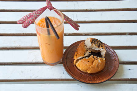 Romantic breakfast-Ice tea and Chocolate bun in coffee shopの写真素材