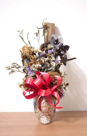 Bouquet of withered flower in vaseの写真素材