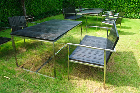 black table and chairs in gardenの写真素材