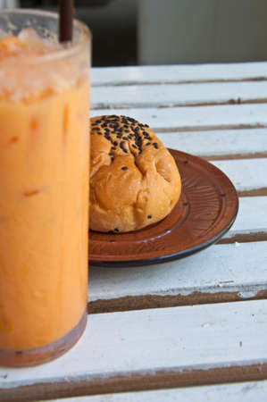 bun with sesame seeds stuff chocolate and Refreshing cold frappe coffeeの写真素材