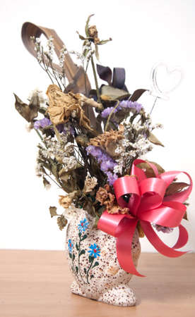 Bouquet of withered flower in vaseの写真素材