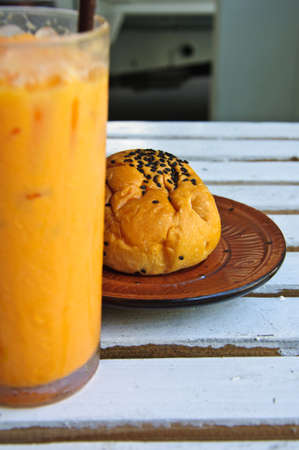 bun with sesame seeds stuff chocolate and Refreshing cold frappe coffeeの写真素材