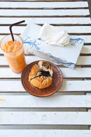 set of breakfast -Refreshing cold frappe tea and bread on tableの写真素材