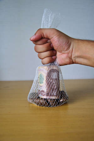concept of save money , Thai money in bagの写真素材