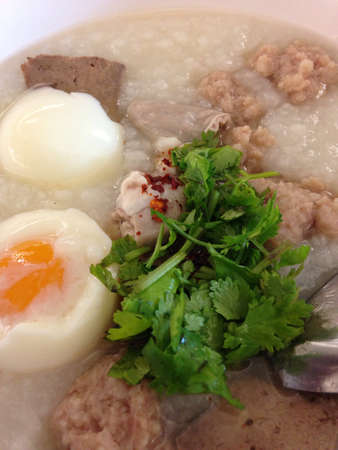 Asian style breakfast soft boiled rice, rice soup Thailand food 