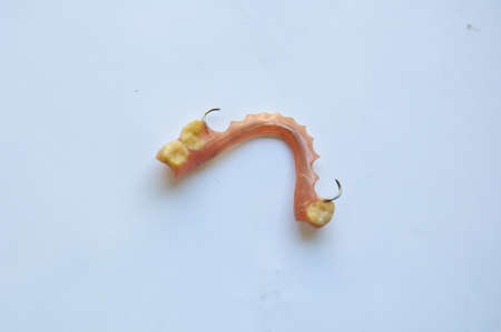 False teeth prosthetic on isolated white backgroundの写真素材