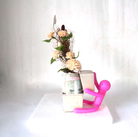 Puppet embrace Thai moneyの写真素材