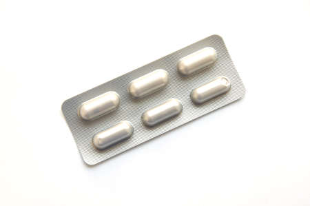 Pack of tablets on a tableの写真素材