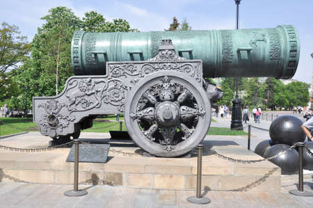 Historic cannon and balls in front of a church at the Kremlin. War and Peace united at the Kremlin.の写真素材