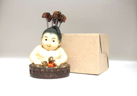 Thai musician Smiling doll made from baked clay play Gong Thai traditional music instrumentの写真素材