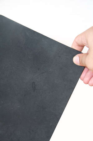 hands holding black book. with using pathの写真素材