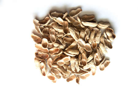 pile of shell peanuts on whiteの写真素材