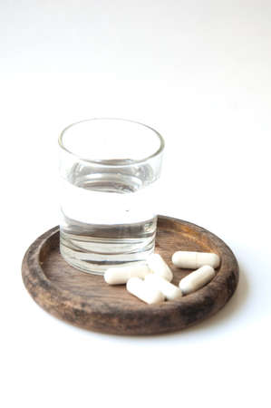 Many pills and glass waterの写真素材
