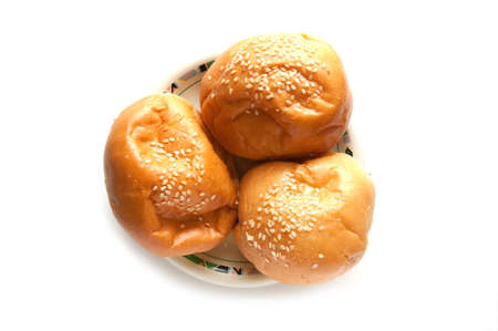 delicious bun with sesame seeds isolated on whiteの写真素材