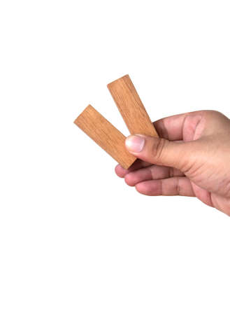man hand holding toy wood, isolated on white background の写真素材