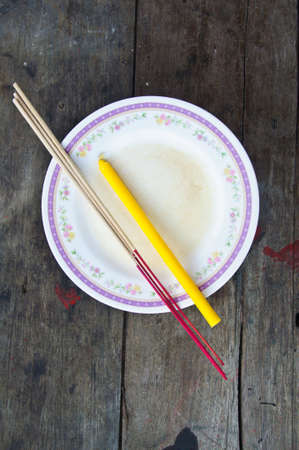 incense and candle for give alms to a Buddhist monkの写真素材