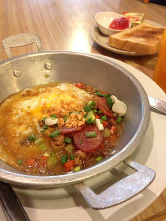 Homemade Thai style fried egg in pan with porkの素材