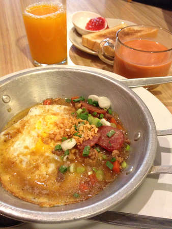 Homemade Thai style fried egg in pan with porkの素材
