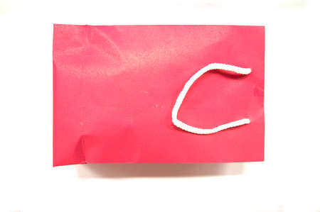 Red shopping bag on white backgroundの写真素材