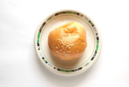 delicious bun with sesame seeds isolated on whiteの写真素材