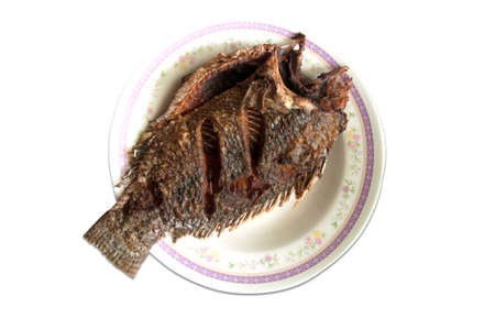 crisp fried Tilapia fish on whiteの写真素材