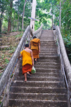 Buddhist monk walking to templeのeditorial素材