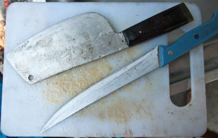 top view of white cutting board and knife