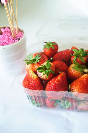 plastic box with strawberriesの写真素材