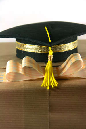 Graduation hat on   gift box a white backgroundの写真素材