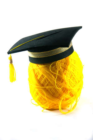 Graduation hat on   Yellow yarn