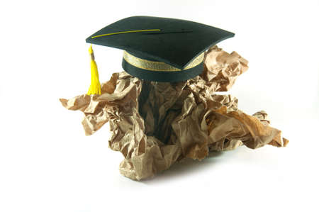 Graduation hat on Crumpled paperの写真素材