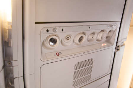 Palne cabin ovehead panel with no smoking sign