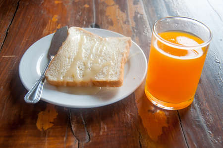 breakfast toast, juice and milkの写真素材