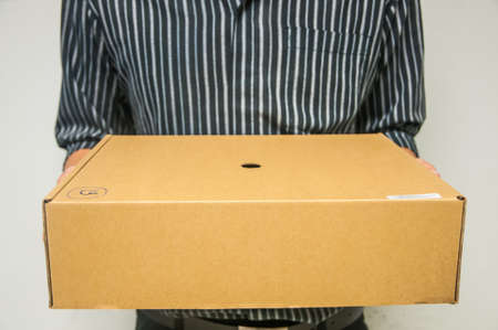 Delivery man gives the parcelの写真素材