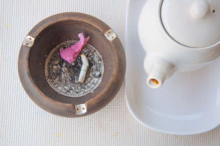 Top view of burning cigarette in ashtrayの写真素材