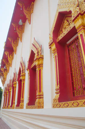 Ancient Gold carving wooden window  at Wat Phothisompom have naga beautiful at Udon Thani, Thailandの写真素材