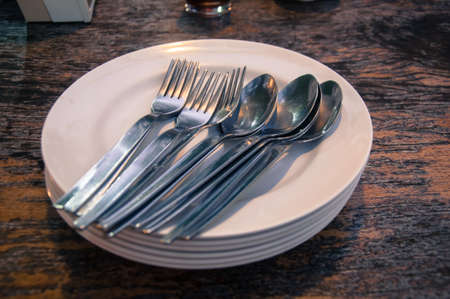 An empty plate on wood table ready to be served
