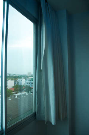 window with white curtains