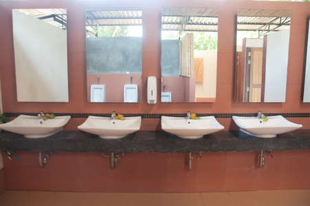 Public empty restroom with washstands mirrorの写真素材