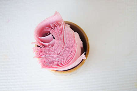 Pink Tissue paper napkins on white tableの写真素材