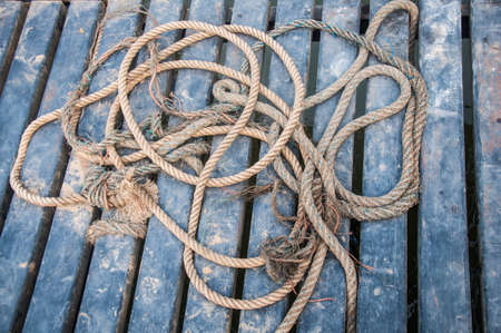 Close-up of old rope on dockの写真素材