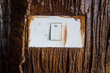 light switch on the wood wall