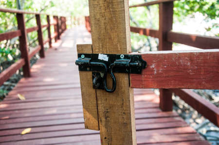 Closeup of  lock wood door in gardenの写真素材