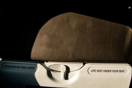 asten seat belt while seated sign on airplaneの写真素材