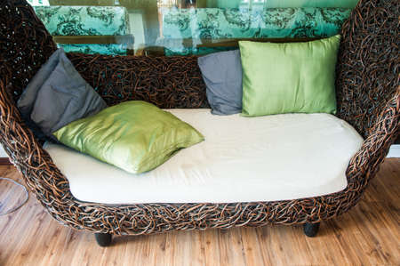 Rattan armchair furniture and many pillow