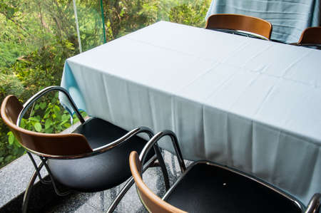 tables and chairs in a cafeの写真素材